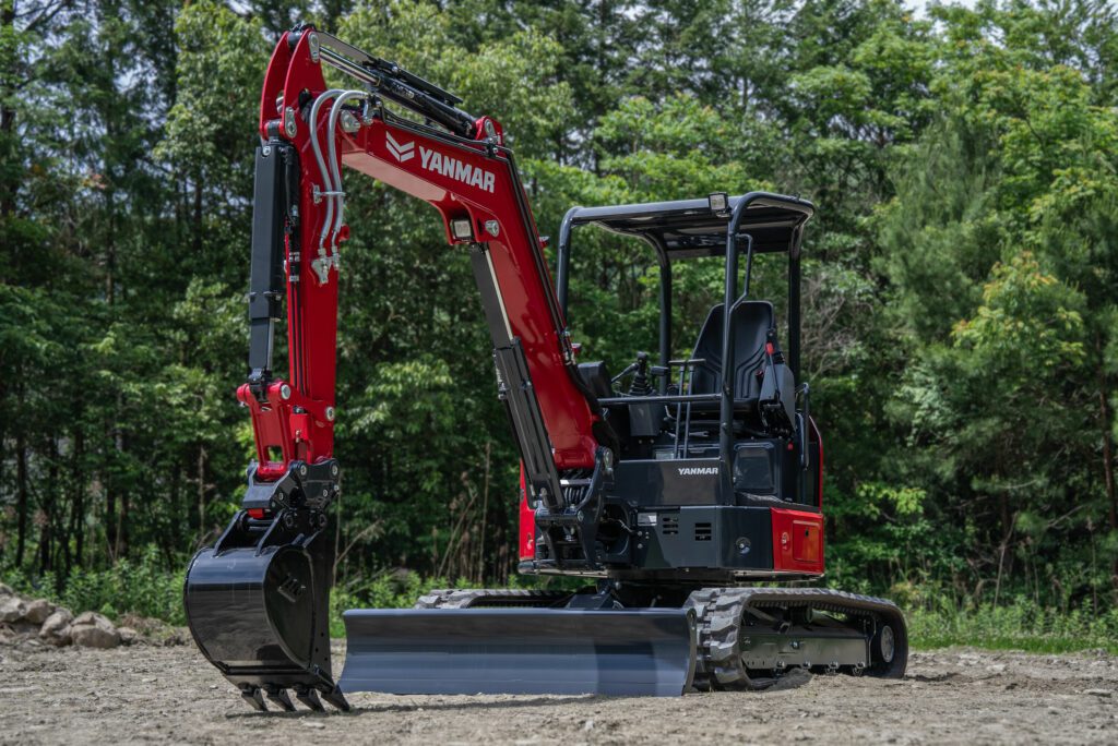 A Yanmar ViO35-7 mini excavator sits on a field