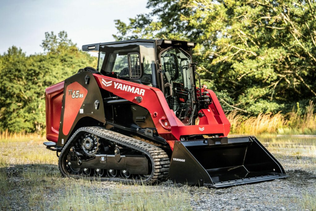 A Yanmar TL65RS Compact Track Loader sits at an angle on gravel