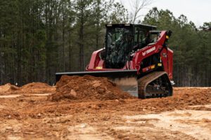 A Yanmar TL80VS compact track loader pushes dirt.