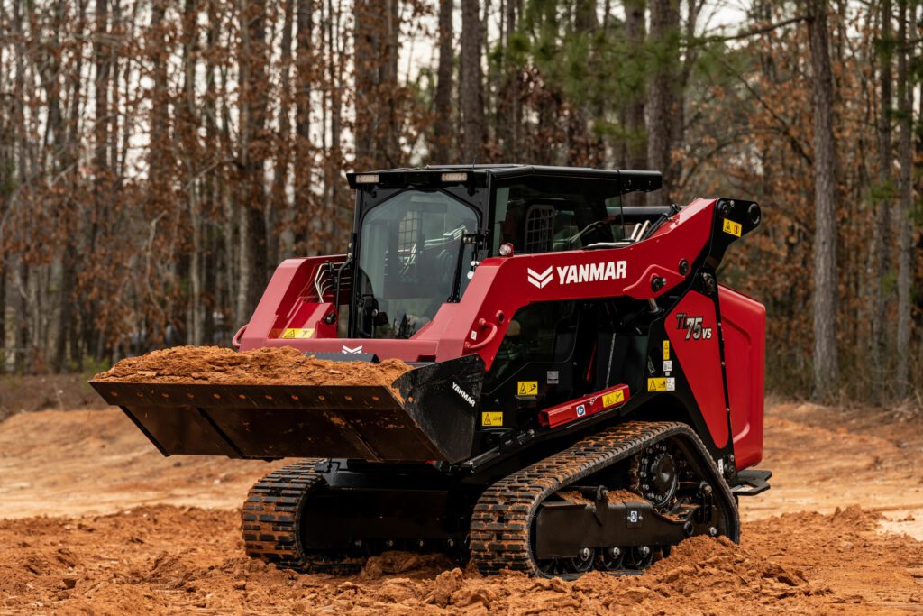 A Yanmar TL75VS compact track loader hauls dirt